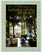 Book cover for "Natural Living by Design" from Abrams, showing a sunlit room with large windows, greenery, modern furniture, and elements of healthy home design for stylish and mindful interiors.