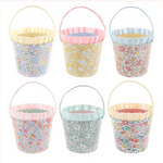 Six MERI x Liberty Paper Baskets by Meri Meri, featuring pastel floral patterns and handles, arranged in two rows of three against a white background—ideal for party favors or Easter egg hunt decorations.