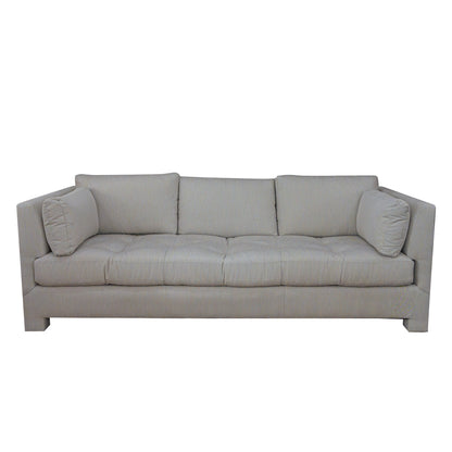 The Highland House Barrett Sofa in Ticking Stripe Dove features a modern light gray upholstery with three seat cushions, three back cushions, straight arms, and two cylindrical side pillows, bringing effortless coastal charm to any space. Subtle ticking stripe accents enhance its timeless appeal.