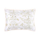 Yves Delorme Botanic Bedding Collection white organic cotton sateen pillow sham featuring a light green botanical print of birds, flowers, and a sun, finished with thin pink piping.