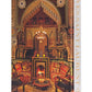 The book "Yves Saint Laurent at Home" by Assouline, features a cover with an ornately decorated room in warm tones and intricate patterns, showcasing the exquisite interior design mastery of Jacques Grange.