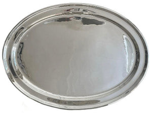 The Vintage Grand Platter from the Dorchester Hotel by Hôtel Silver is an empty, oval-shaped silver serving tray with a reflective surface, reminiscent of collectible vintage hotel silver.