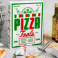 The Essentials Pizza Tools by PrintWorks, crafted from stainless steel and packaged in a pizza box design, sit on a marble counter with pizza slices and accessories—an essential upgrade to any pizza kit.