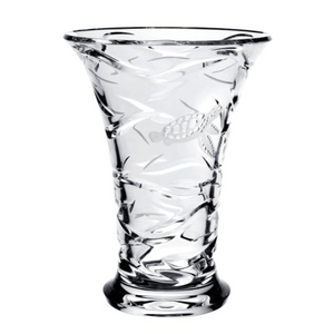 The Persephone Vase by William Yeoward Crystal is a clear glass vase with an etched fish, sea creatures, and wave pattern, featuring a flared rim and round base.