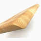 A close-up view of the J.K. Adams Infinity Edge Maple Cutting Board highlights its smooth, beveled edge and natural maple grain, providing a durable and stylish cutting surface.