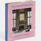 The Phaidon book "Italian Interiors: Rooms with a View" features a room with expansive windows and sophisticated decor, embodying the spirit of Italian interior design.