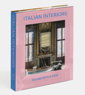 The Phaidon book "Italian Interiors: Rooms with a View" features a room with expansive windows and sophisticated decor, embodying the spirit of Italian interior design.