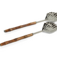 The Colony Bamboo and Nickel Serving Sets by Zodax feature two stylish serving utensils with leaf-shaped nickel scoops and bamboo handles, displayed side by side on a white background—perfect for modern table settings.