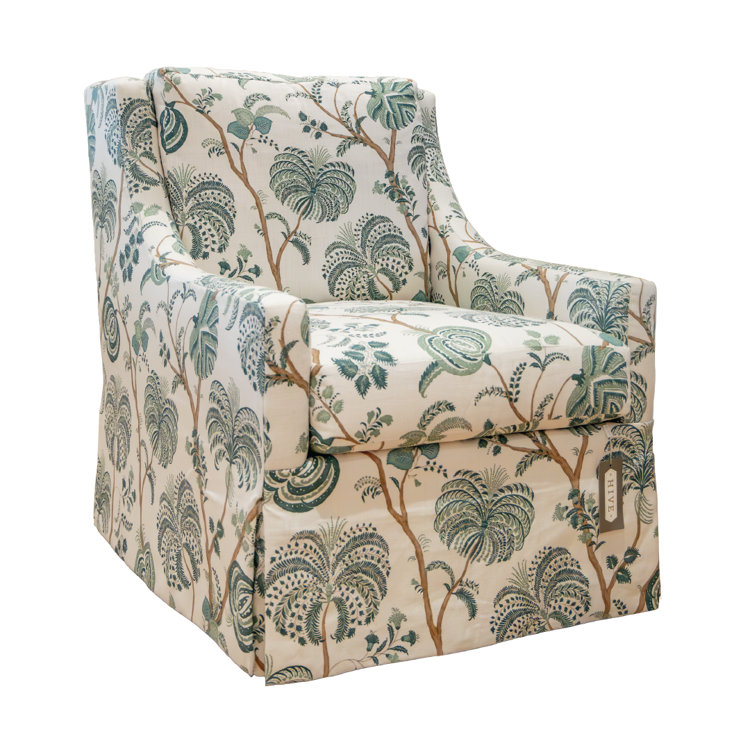 The Chatham Swivel Chair by Hickory Chair features a botanical print in green and beige, echoing the elegance of a classic English club chair with its skirted base and gently curved arms—bringing timeless style to any West Palm Beach-inspired interior.