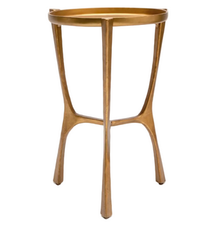 The Addison Accent Table by Made Goods features a small, round aged brass design with three legs and a raised rim, making it ideal as a stylish side table, nightstand, or removable tray table.