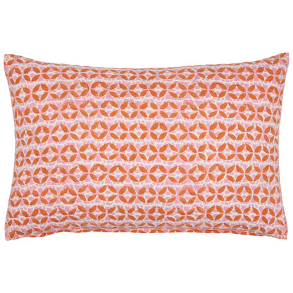 The Ambar Kidney Pillow by John Robshaw is a rectangular lumbar pillow with an orange and white geometric design, made from a linen-cotton blend.