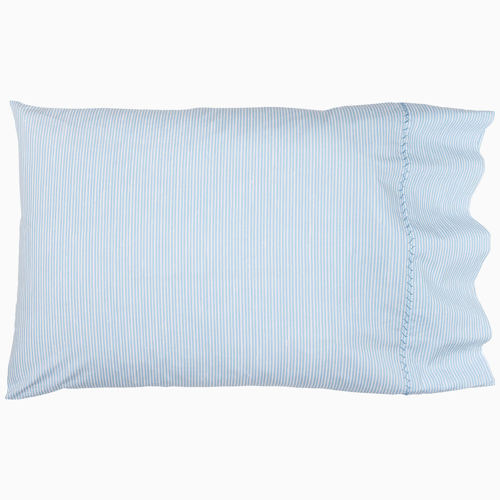 The Nandi Light Indigo Sheet Set by John Robshaw features a light blue and white vertical pinstripe pattern, crafted from organic cotton bedding in India, shown on a white background.