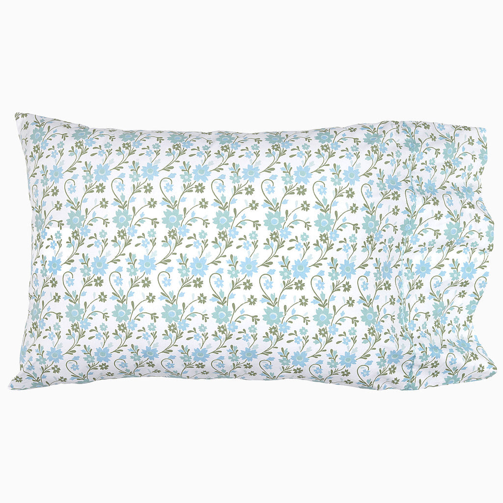 The Mihana Mist Bedding Collection by John Robshaw features a rectangular pillow with a white organic cotton cover, 400 thread count, and a blue-green floral pattern for botanical harmony and comfort.