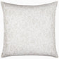 The Meera Sand decorative pillow by John Robshaw features a white and beige floral pattern, perfect for pairing with the elegant Meera Sand Bedding Collection or a woven coverlet.