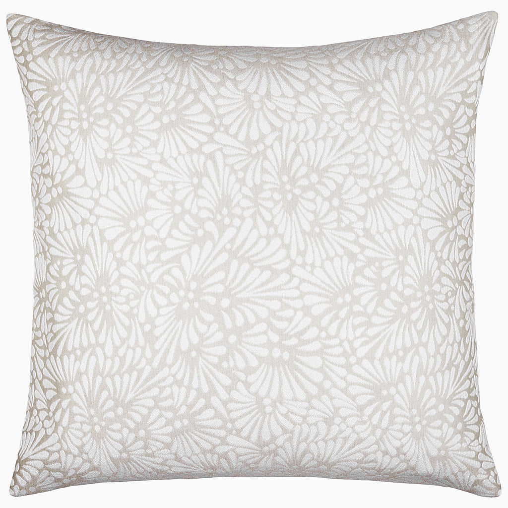 The Meera Sand decorative pillow by John Robshaw features a white and beige floral pattern, perfect for pairing with the elegant Meera Sand Bedding Collection or a woven coverlet.