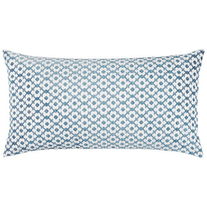 The Nalin Light Indigo Bolster by John Robshaw is a rectangular blue pillow with a white geometric pattern of repeating circular shapes, inspired by woven ikats.