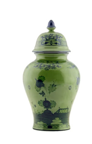 A green ceramic lidded vase from the Oriente Italiano Malachite Dinnerware & Decor Collection by Ginori 1735, featuring dark blue floral and landscape designs, shown on a white background.