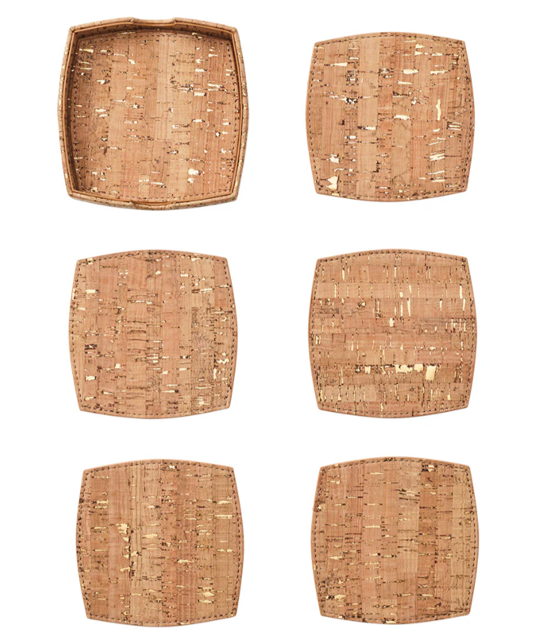 The Kim Seybert Whistler Coaster Set with Caddy includes six cork coasters—one with raised tray-like edges and five flat, heat-resistant coasters—arranged neatly in two columns.