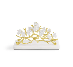 The Michael Aram Butterfly Gingko Gold Vertical Napkin Holder features gold branches and white ginkgo leaves, making it a stylish and elegant addition to your table décor.