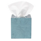 Square blue tissue box holder from the Navagio Bath Collection by Pigeon & Poodle, featuring a textured, spiraled burl resin pattern and containing a white tissue.