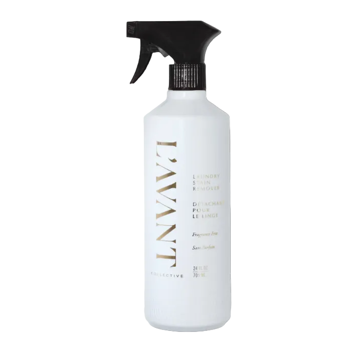 White L’Avant Collective Unscented Stain Remover spray bottle with a black trigger nozzle.