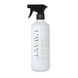 White L’Avant Collective Unscented Stain Remover spray bottle with a black trigger nozzle.