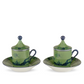 Two ceramic cups with lids from the Ginori 1735 Oriente Italiano Malachite Dinnerware & Decor Collection, featuring green and blue tones, are each placed on a matching saucer and arranged side by side against a plain white background.