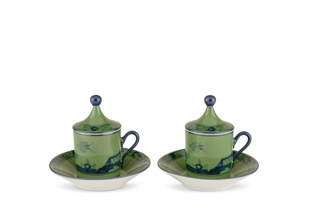 Two ceramic cups with lids from the Ginori 1735 Oriente Italiano Malachite Dinnerware & Decor Collection, featuring green and blue tones, are each placed on a matching saucer and arranged side by side against a plain white background.