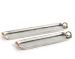 The Helena Long Tray Collection by Napa Home & Garden features two cast aluminum trays with rattan-wrapped handles and raised edges, displayed side by side on a white background for a stylish designer look.