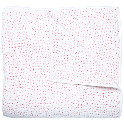 The John Robshaw Stitched Coverlet, Lotus, is a white cotton voile quilt made in India, featuring small red stitches and a corner flipped to reveal its artisanally hand-stitched underside.