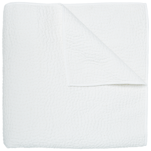 The Stitched White Coverlet by John Robshaw, made in India from soft cotton voile with a subtle textured pattern, is neatly folded with one corner turned down and displayed on a plain white background.