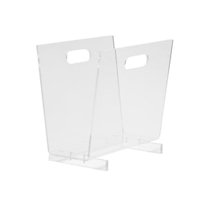 The Laurel Acrylic Magazine Holder by Pigeon & Poodle features two angled panels, handle cutouts on each side, and a sturdy flat base for a contemporary look.