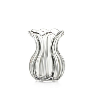 The Simon Pearce Chelsea Optic Posy Vase, featuring a wavy, fluted design and a transparent base, makes an ideal housewarming gift.