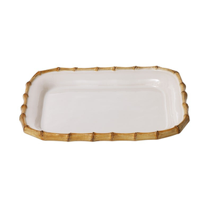 This Juliska Classic Bamboo Small Rectangular Platter features a sleek white design with a touch of bamboo trim.