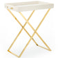 The Butler Tray Stand by Aerin features a white rectangular tray with handles on a solid brass X-frame, offering a modern folding table ideal for serving and entertaining at home.