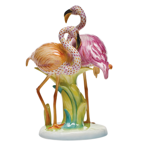 Herend's Flamingo Duet, Multicolor: a limited edition porcelain figurine featuring two hand-painted flamingos, one orange and one pink, standing among green reeds on a glossy white base.
