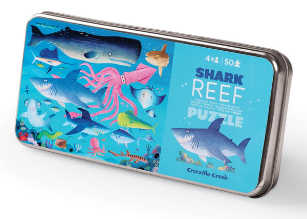 A colorful "Crocodile Creek 50 Piece Puzzle" in a tin box, featuring illustrated ocean creatures like sharks and an octopus, designed for children aged 4 and up.