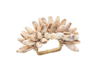 The Kim Seybert Shell Fringe Napkin Ring showcases multiple acrylic shells on a wrapped rectangular handle, making it ideal for a beach-inspired table setting.
