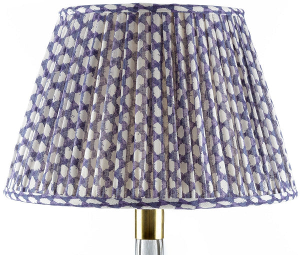 A Fermoie Wicker Lamp Shade in Indigo with a blue and white polka dot pattern, brand John Rosselli.