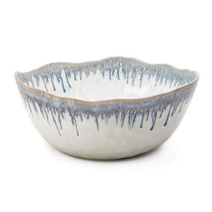 The Burlington Pool Serving Bowl by Simon Pearce features a handmade design with a scalloped rim and striking blue pool glaze along the upper edge, set against a white background.