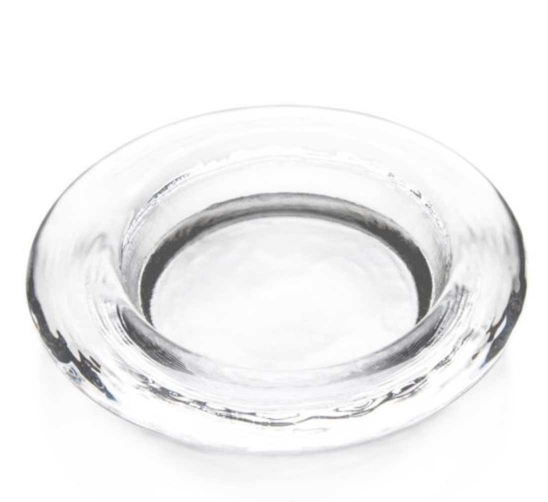 The Simon Pearce Hanover Glass Wine Coaster features a round, wide-rimmed design in crystal-clear glass, offering elegant table protection. Displayed on a white background.