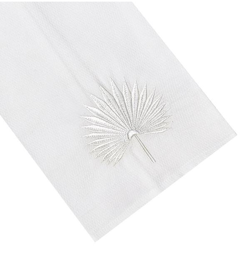 Haute Home's White cotton huck napkin with a machine embroidered silver Palm Leaf Tip Towel design on one corner.