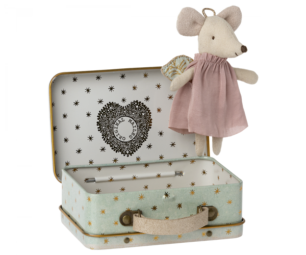 A Maileg Angel Mouse in Suitcase guardian angel in a dress standing next to an open, patterned metal suitcase with metallic details.