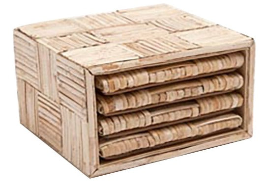 A Grasse Natural Cane Skin Coasters set from Blue Pheasant with a textured, square holder containing five coastal-inspired coasters stacked horizontally.
