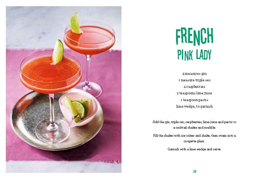 Two pink gin-based cocktails in coupe glasses with lime wedges are placed beside a metallic plate with a lime wedge. The recipe for the "French Pink Lady," an enticing gin cocktail, can be found in *The Little Book of Gin Cocktails* by Penguin Random House, displayed on the right.