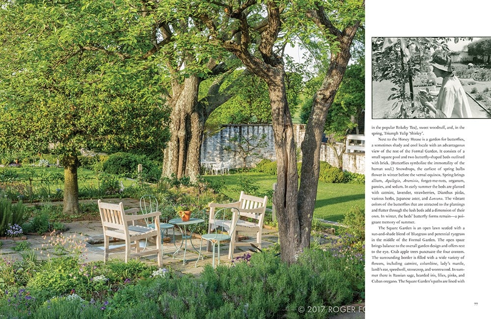 A serene garden scene with wooden chairs and a table under leafy trees reflects Bunny Mellon's exquisite design, as featured in "Gardens of Bunny Mellon" by Common Ground, with lush greenery and a partially visible text page on the right.