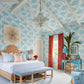 Bright and airy bedroom with Beachside: Windsor Architecture and Design's blue floral wallpaper, matching textiles, and seaside living-inspired decor from Common Ground.