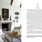 Stylish living room with a light color palette, featuring a fireplace, a central wooden coffee table adorned with greenery, and framed pictures on the wall. The text on the right side discusses "Atmosphere: The Seven Elements of Great Design" by Common Ground and its contribution to creating an evocative atmosphere.