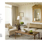 A living room with a beige color scheme features a sofa, armchairs, a wooden coffee table, a large gold-framed mirror, and a floor lamp. Text on the left side reads about the great design and quality classical period designs described in "Atmosphere: The Seven Elements of Great Design" by Common Ground, creating an evocative atmosphere of luxurious home interiors.