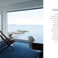 Ocean view from an At Home on the Water room in a coastal living retreat with a single chair near the window.